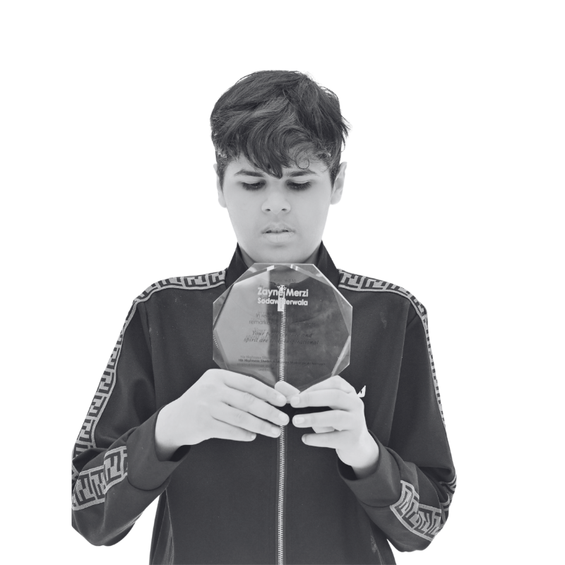  Zayne Merzi Sodawaterwala holding a trophy 