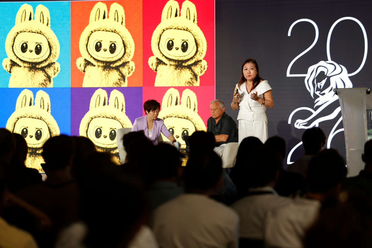 Siew Ting Foo on stage with Sir Martin Sorrell and BYD's Stella Li 