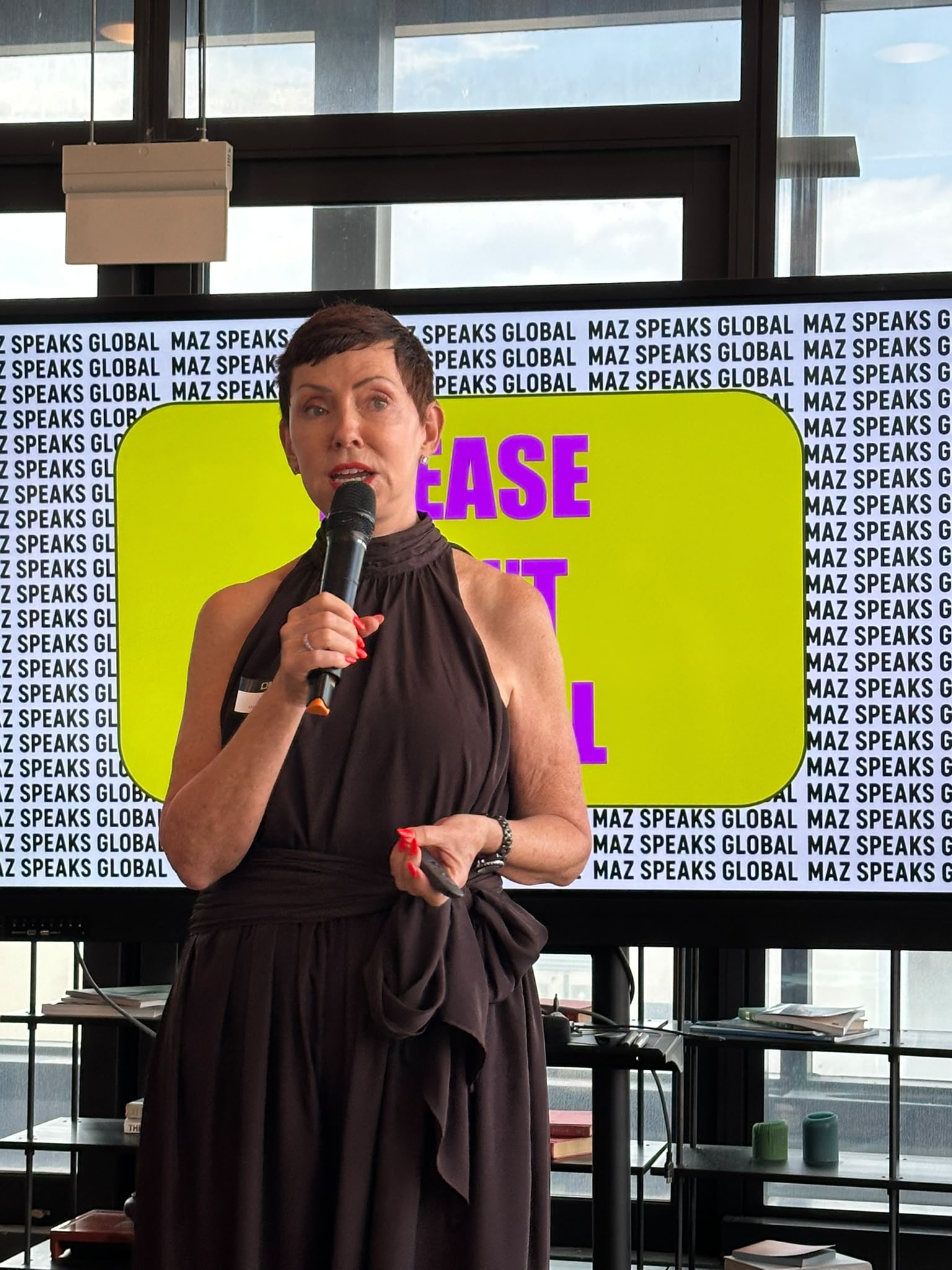 Maz Farrelly holding a mic in her session