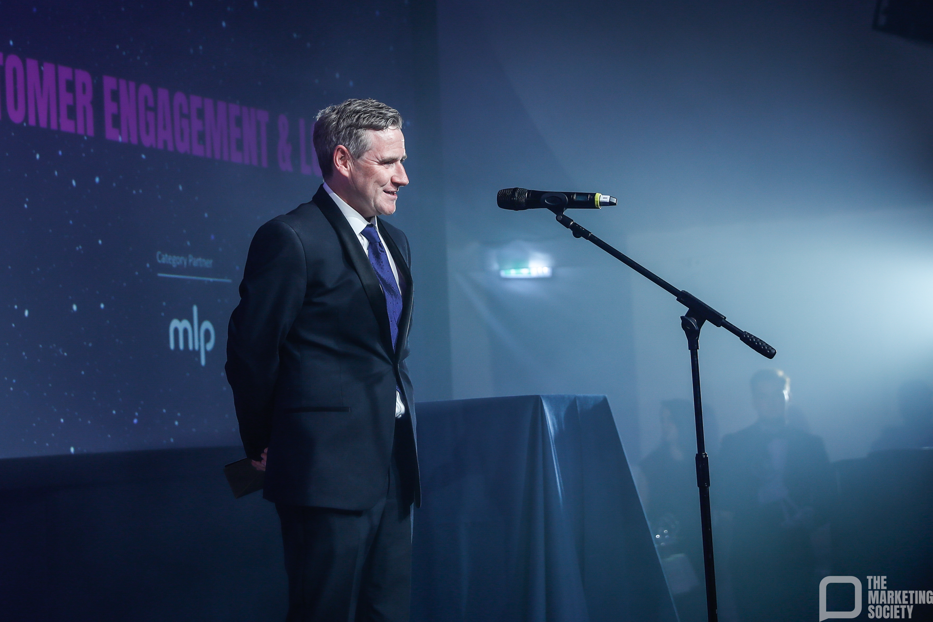 Simon Jamieson MLP on stage at The Marketing Society Global Awards 2025