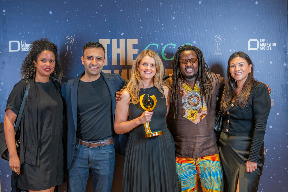 People holding the GCC Awards trophy