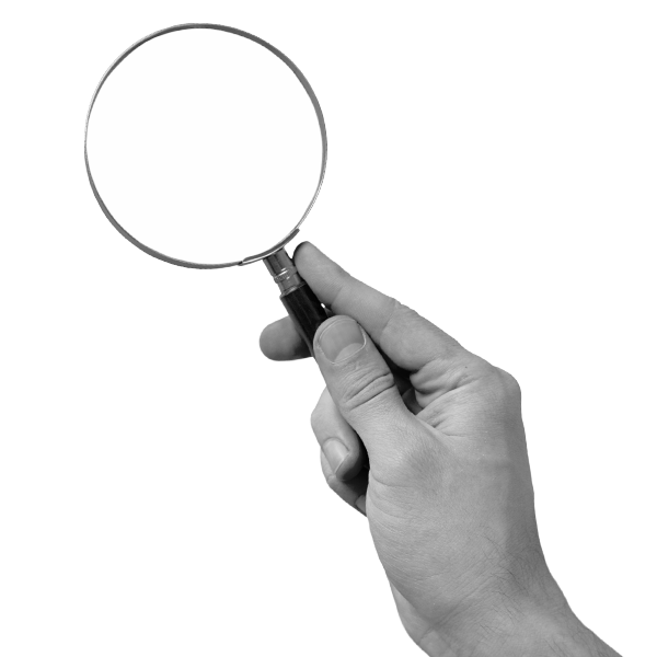 Hand holding magnifying glass