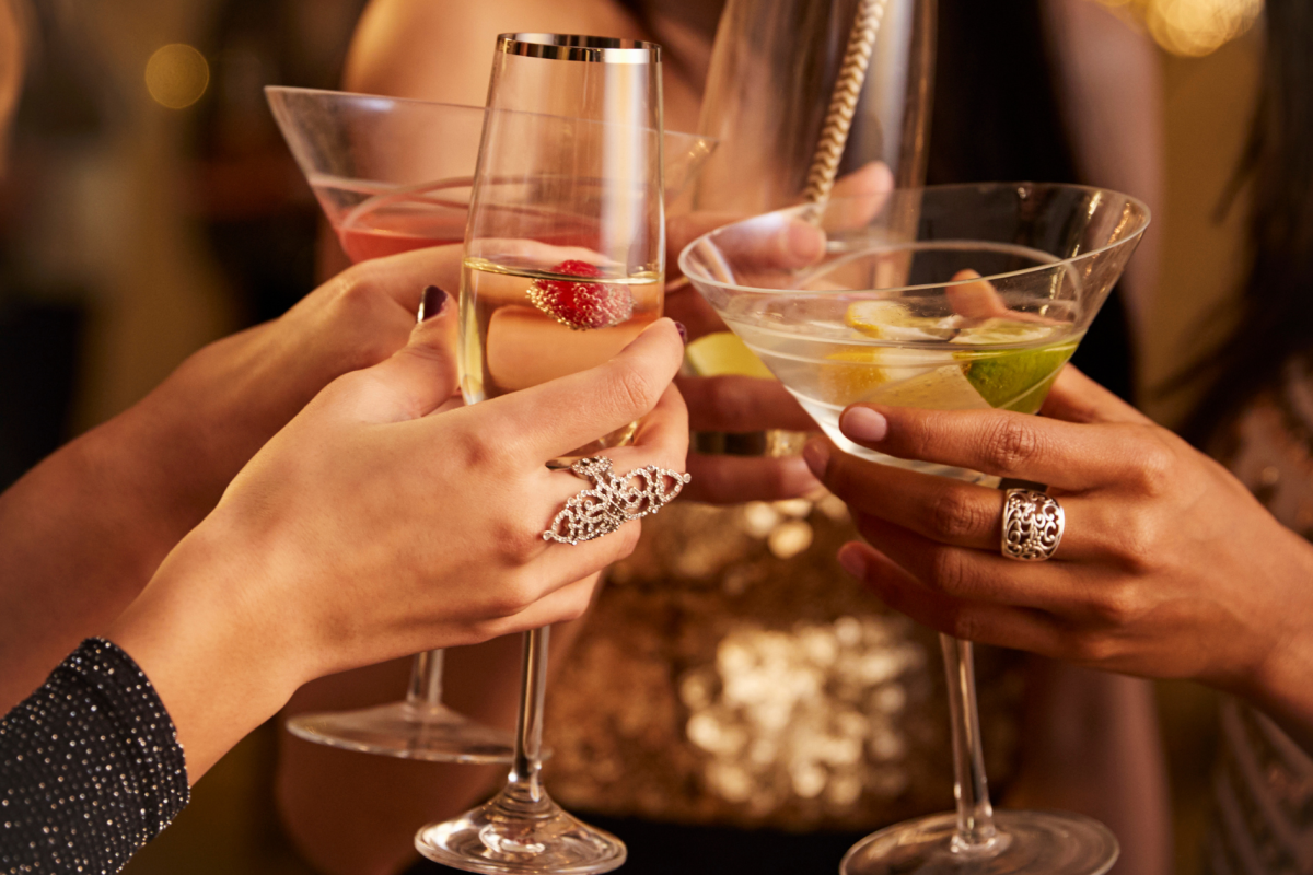 people cheering with drinks 