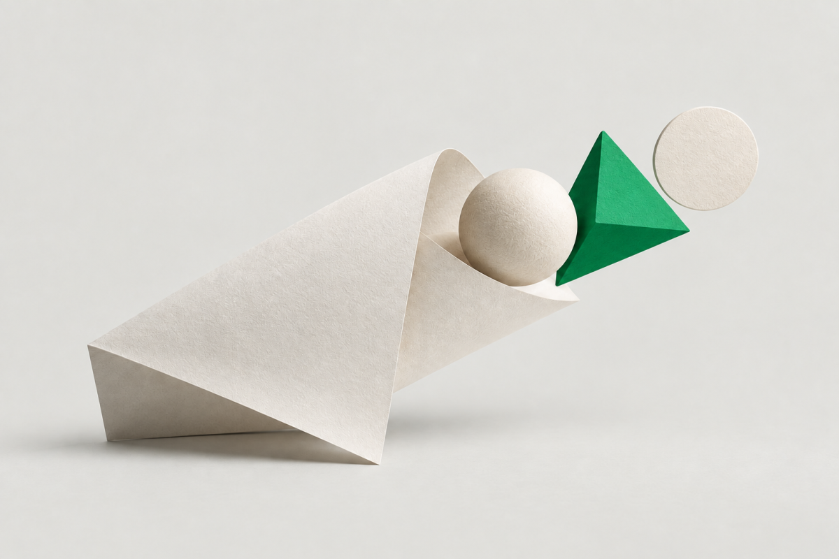 Abstract folded paper with a sphere, bright green prism and circular disc on a cool grey background, representing creative ideas taking shape from a clear brief.