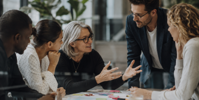 Collaborative Meeting Around a Paper-Covered Table